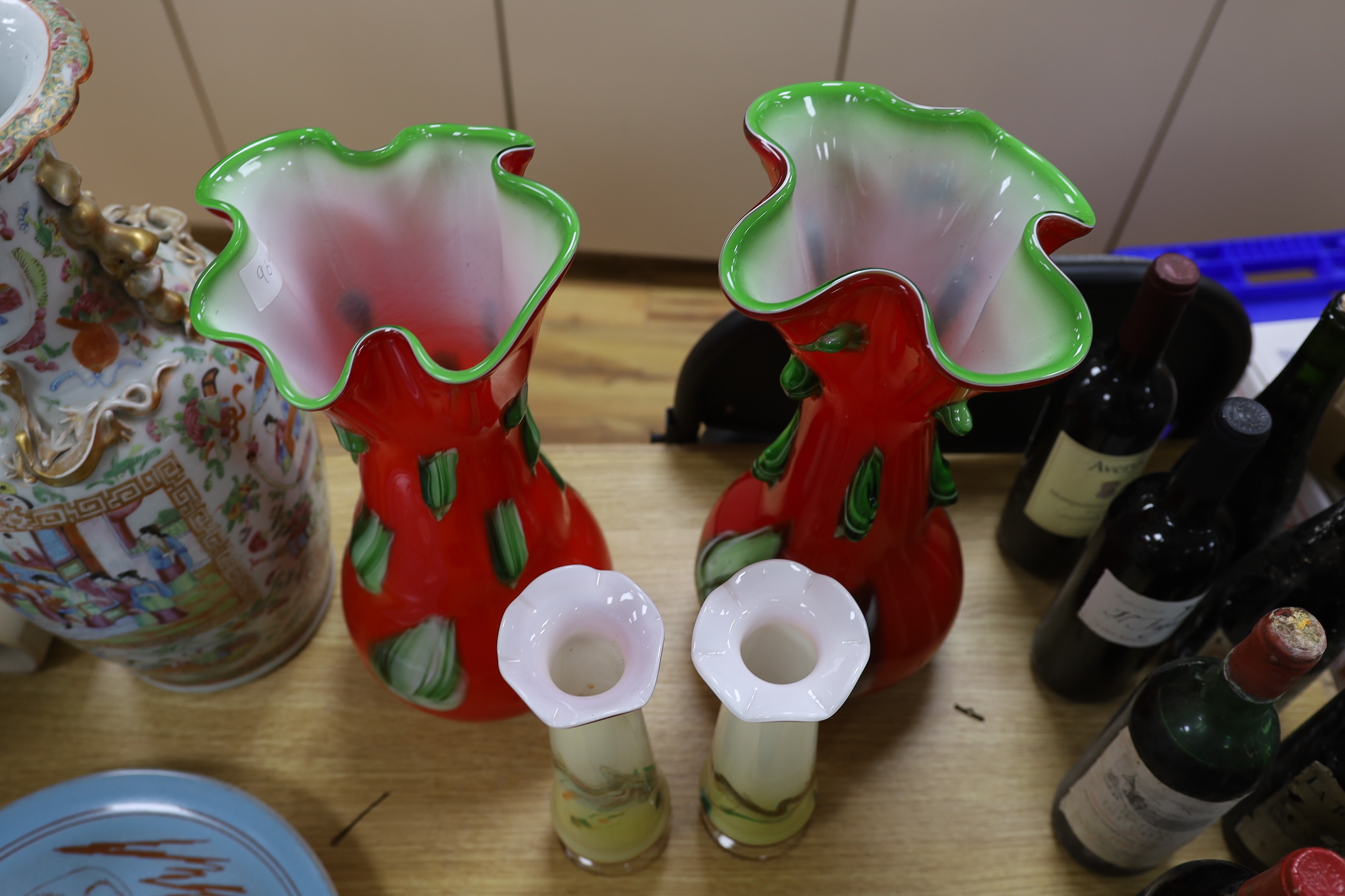 A large pair of Darrius Zarrin red and green glass vases together with another smaller pair of vases, tallest 41cm